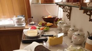 A breakfast buffet with bread, pastries, cheese, and fruit. - Nya Pallas Hotel (Falkenberg)