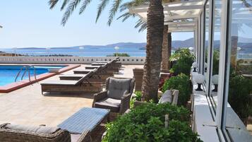 Seasonal outdoor pool, pool umbrellas, pool loungers