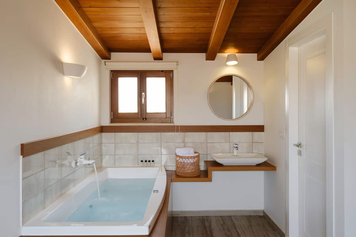 penthouse (suite with caste view) | bathroom | shower, rainfall showerhead, hair dryer, slippers