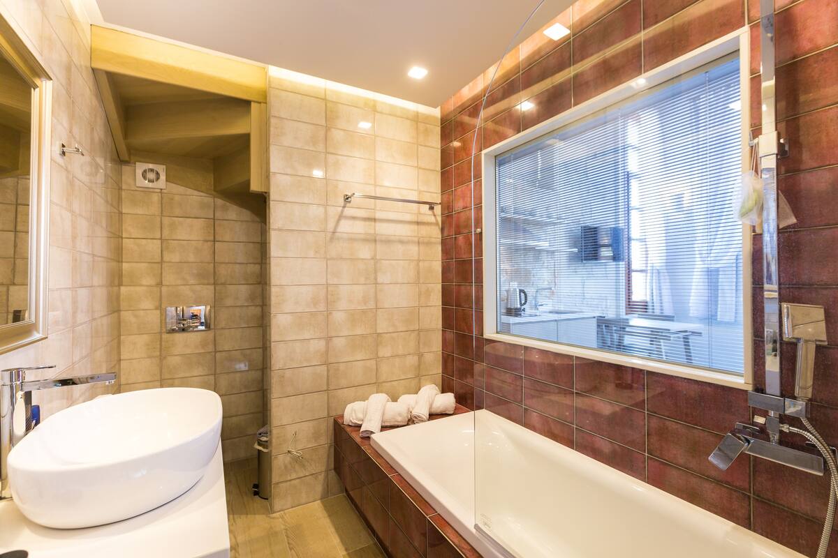 superior duplex | bathroom | shower, rainfall showerhead, hair dryer, slippers