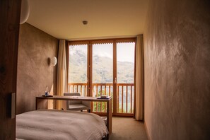 Hypo-allergenic bedding, desk, laptop workspace, blackout curtains