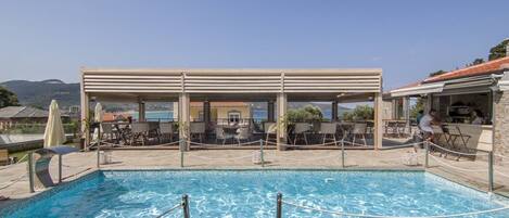 Outdoor pool, open 9:00 AM to 8:00 PM, sun loungers