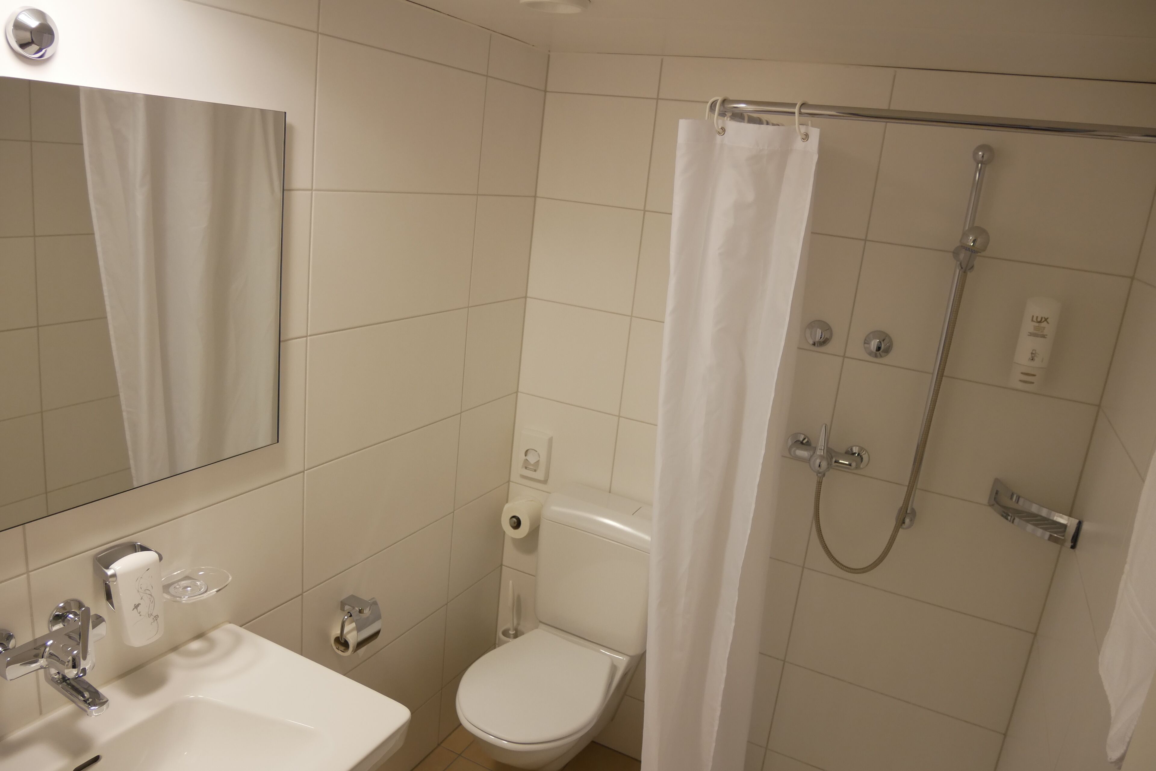 hair dryer, slippers, towels, soap