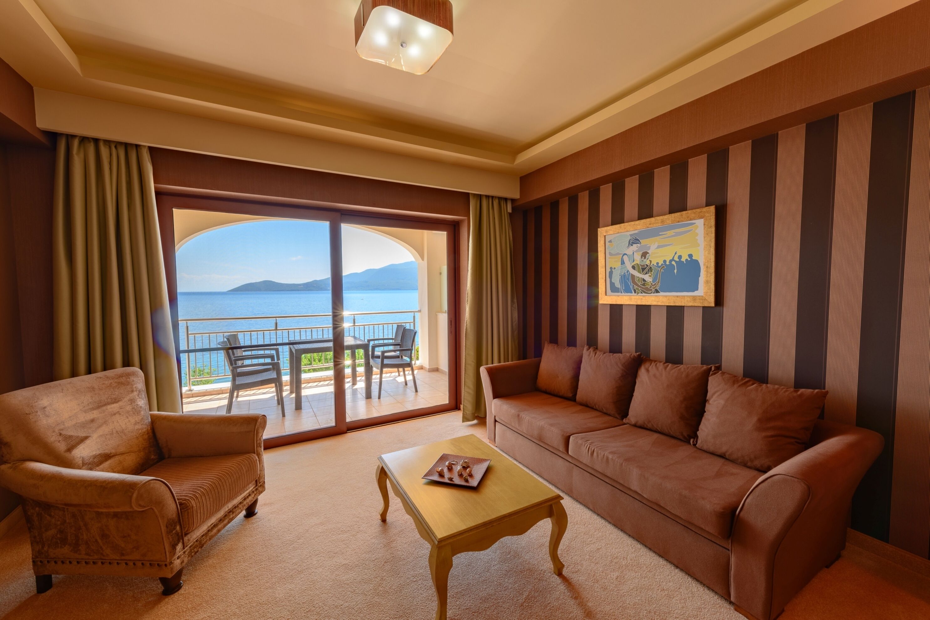 Junior Suite, Sea View | Minibar, in-room safe, individually decorated, desk