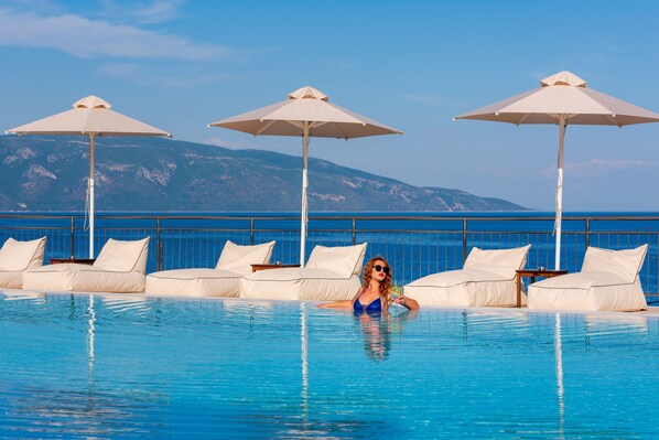 2 outdoor pools, open 9:00 AM to 7:00 PM, pool umbrellas, pool loungers