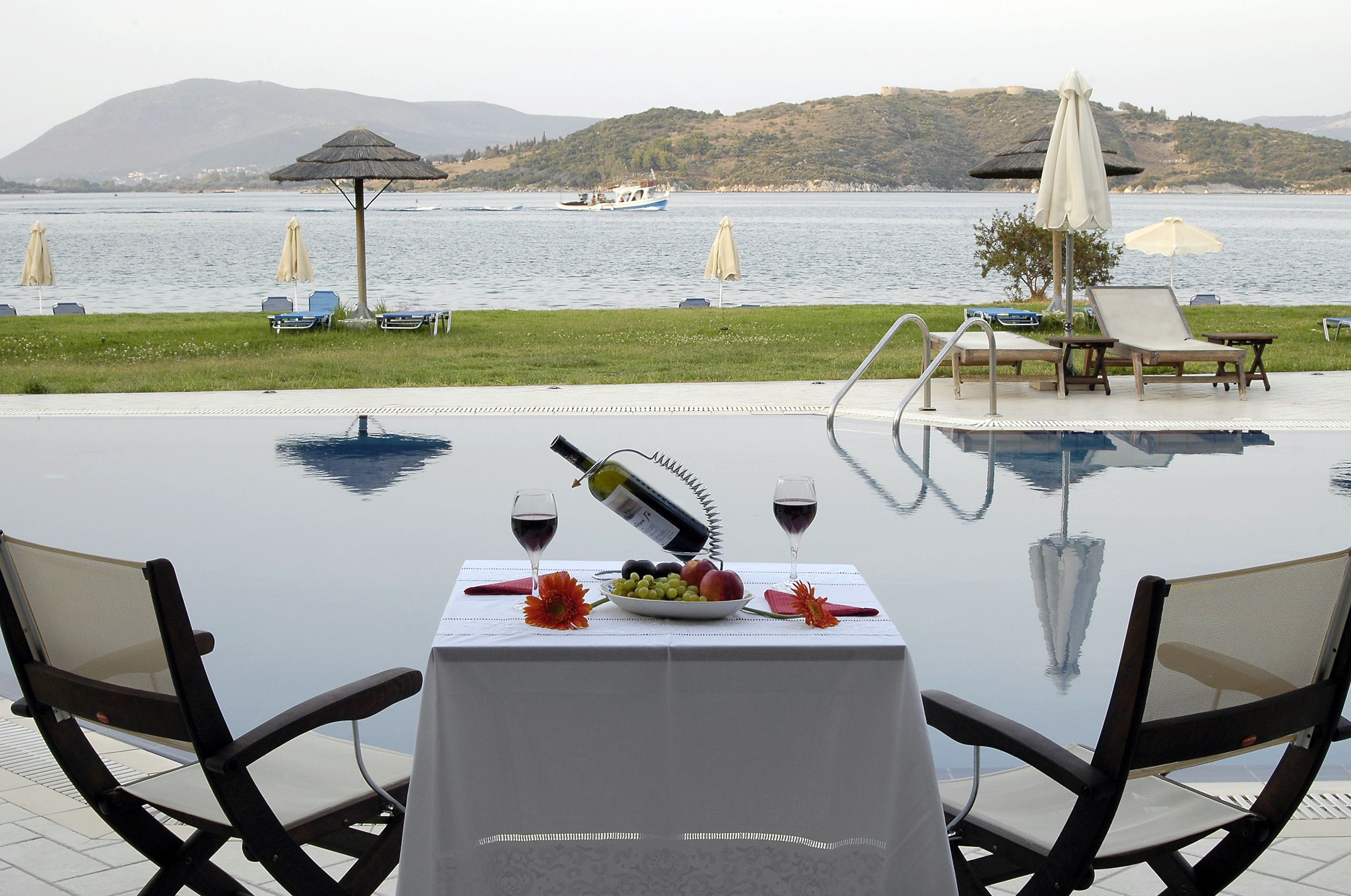 outdoor pool, open 9:00 am to 8:30 pm, pool umbrellas, pool loungers