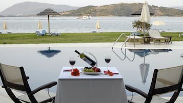 Outdoor pool, open 9:00 AM to 8:30 PM, pool umbrellas, pool loungers