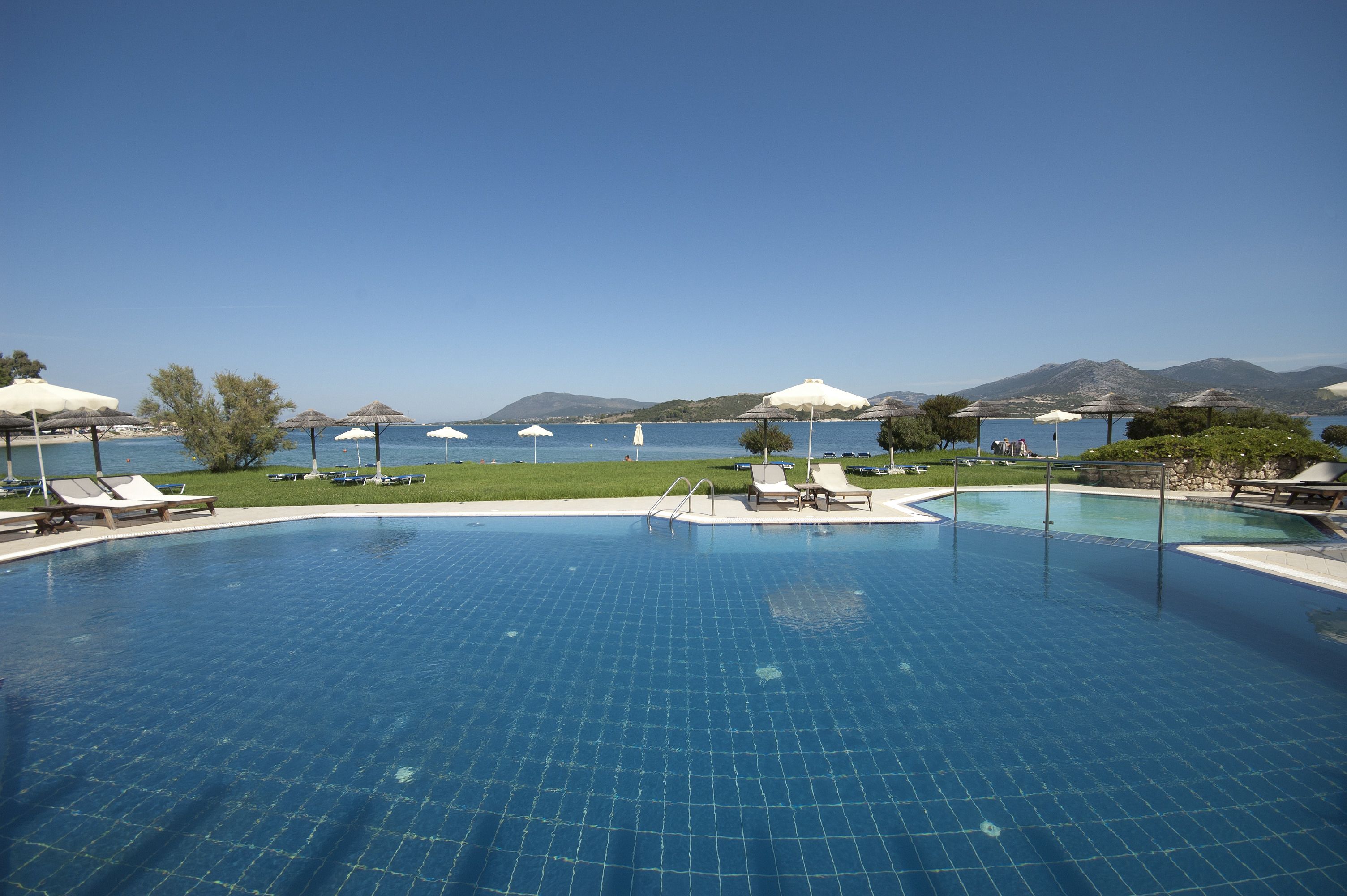 outdoor pool, open 9:00 am to 8:30 pm, pool umbrellas, pool loungers