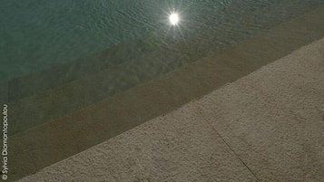 Outdoor pool, open 11:00 AM to 8:00 PM, pool umbrellas, pool loungers