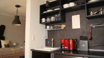 Design Studio, 1 Queen Bed | Private kitchen | Full-sized fridge, oven, stovetop, dishwasher