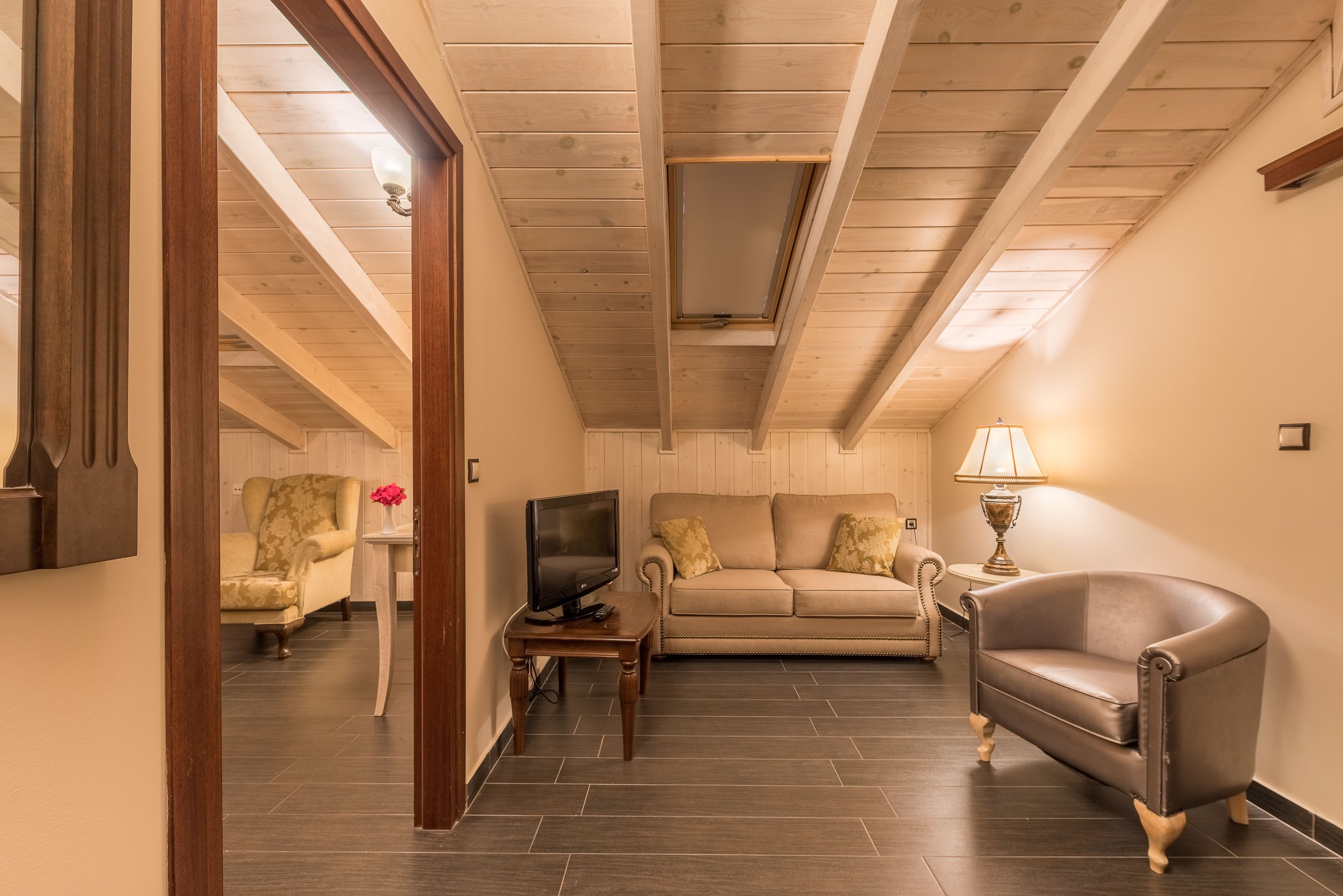 superior suite, sauna | living room | 32-inch flat-screen tv with satellite channels, tv