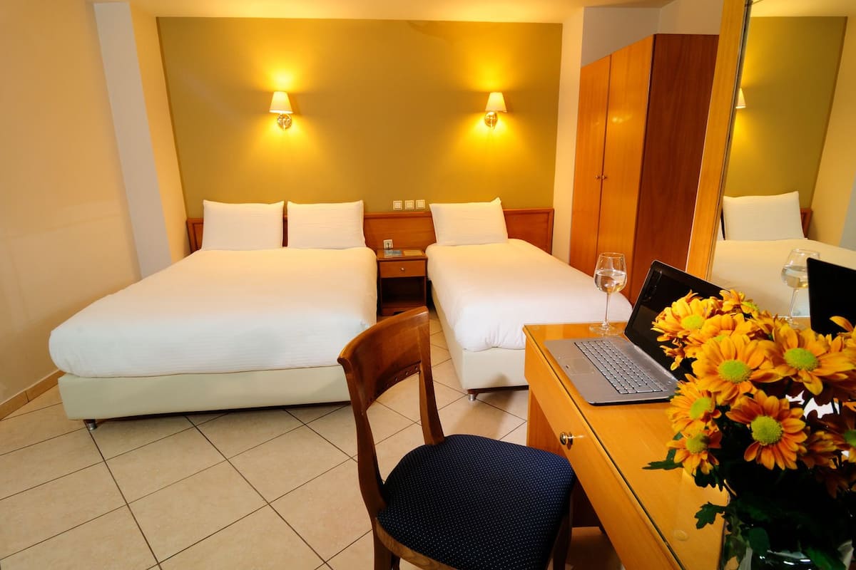 Triple Room, Balcony, City View | Egyptian cotton sheets, premium bedding, pillow-top beds, in-room safe