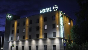 A modern hotel building with a prominent 'HOTEL' sign at the top. - B&B Hotel Torun (Torun)