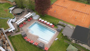 Relax by the pool or enjoy a game of tennis in our resort's outdoor space.