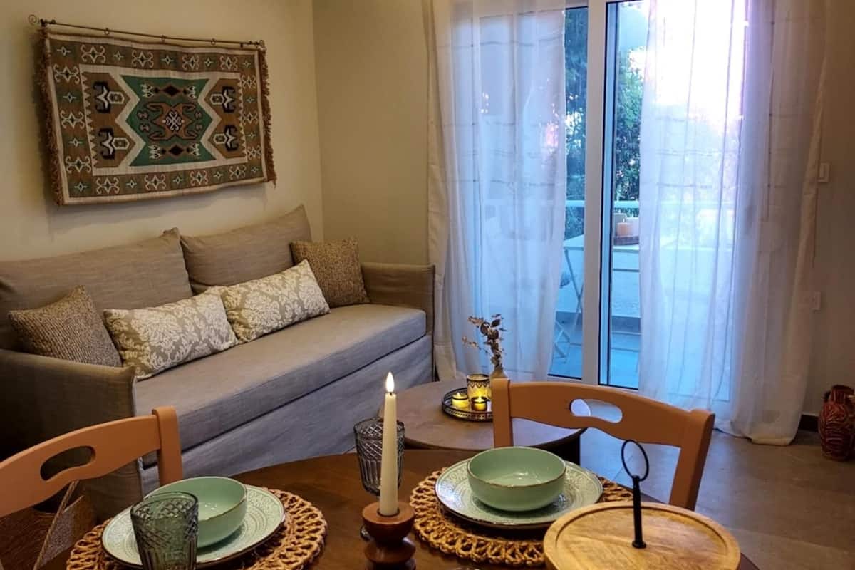 Traditional Apartment | Living area | 42-inch Smart TV with cable channels