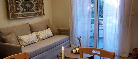 Traditional Apartment | Living area | 42-inch Smart TV with cable channels