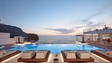 Seasonal outdoor pool, open 10:00 AM to 6:00 PM, pool umbrellas