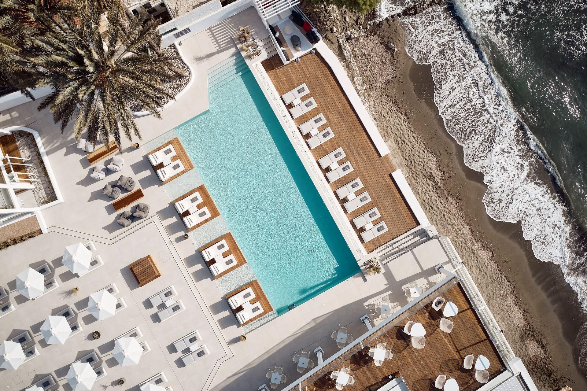 Seasonal outdoor pool, open 10:00 AM to 6:00 PM, pool umbrellas