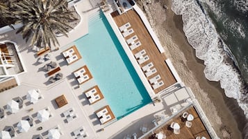 Seasonal outdoor pool, open 10:00 AM to 6:00 PM, pool umbrellas