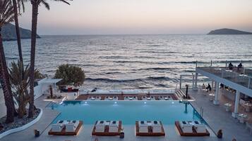 Seasonal outdoor pool, open 10:00 AM to 6:00 PM, pool umbrellas