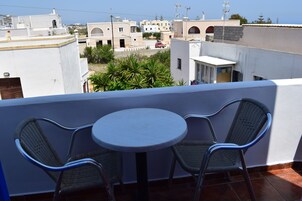 Economy Triple Room, Courtyard View | In-room safe, blackout drapes, iron/ironing board, free WiFi