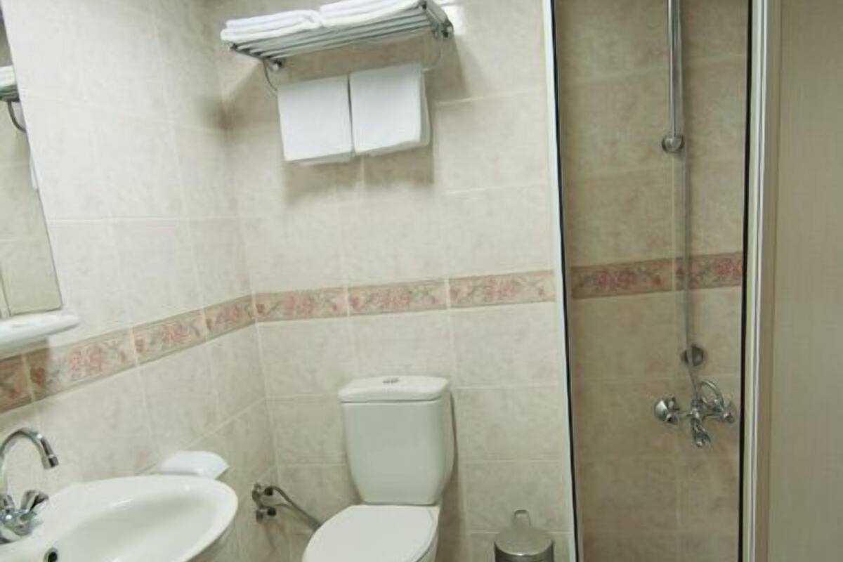 Shower, free toiletries, hair dryer, slippers