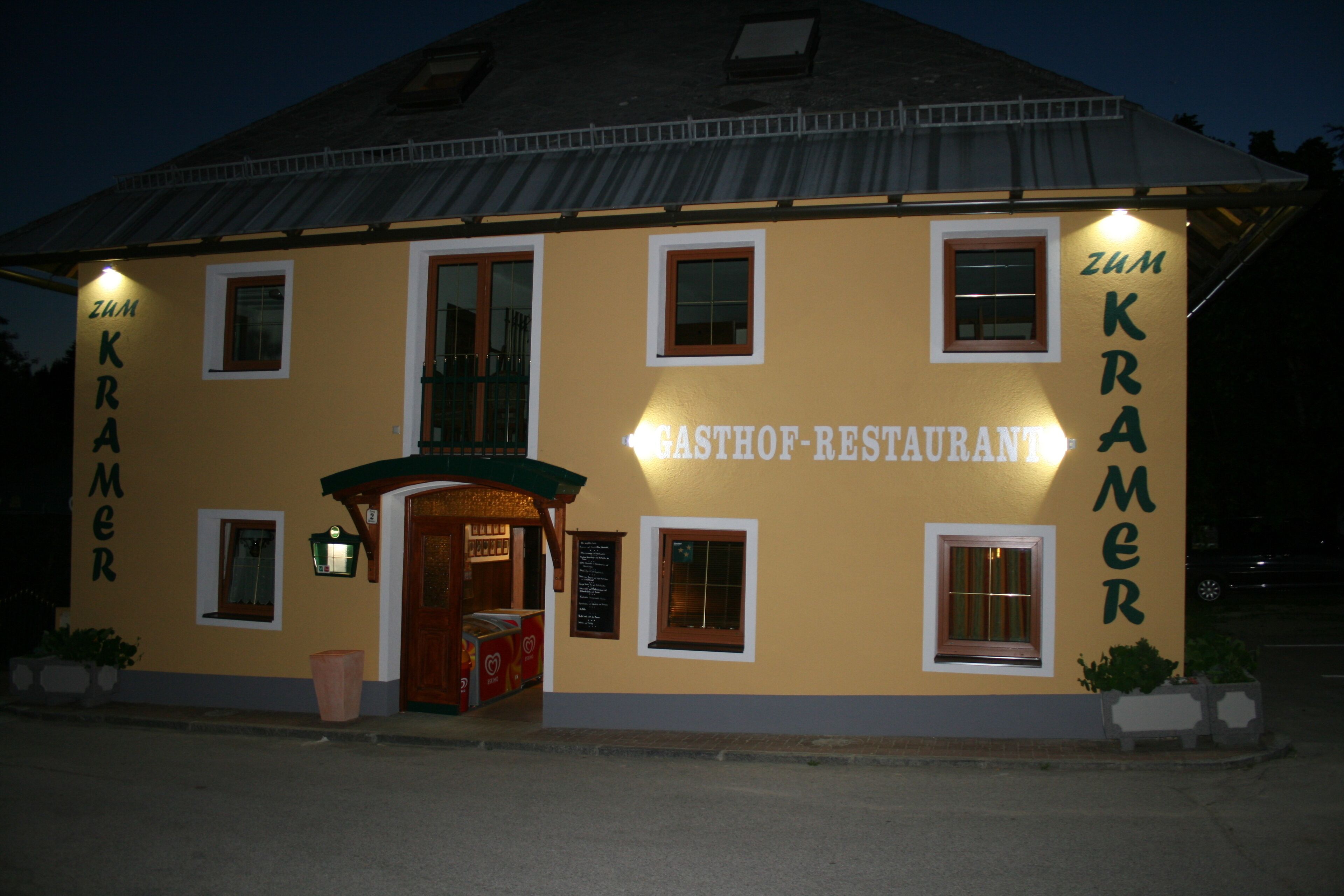 A building with the sign "Zum Kramer Gasthof-Restaurant" indicating it is a restaurant.