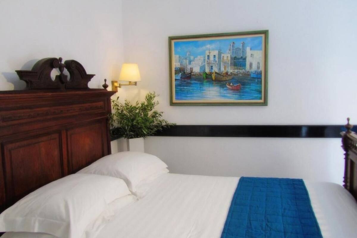 Habitación familiar, 2 habitaciones, vista a la alberca | Ropa de cama de alta calidad y caja de seguridad en la habitación