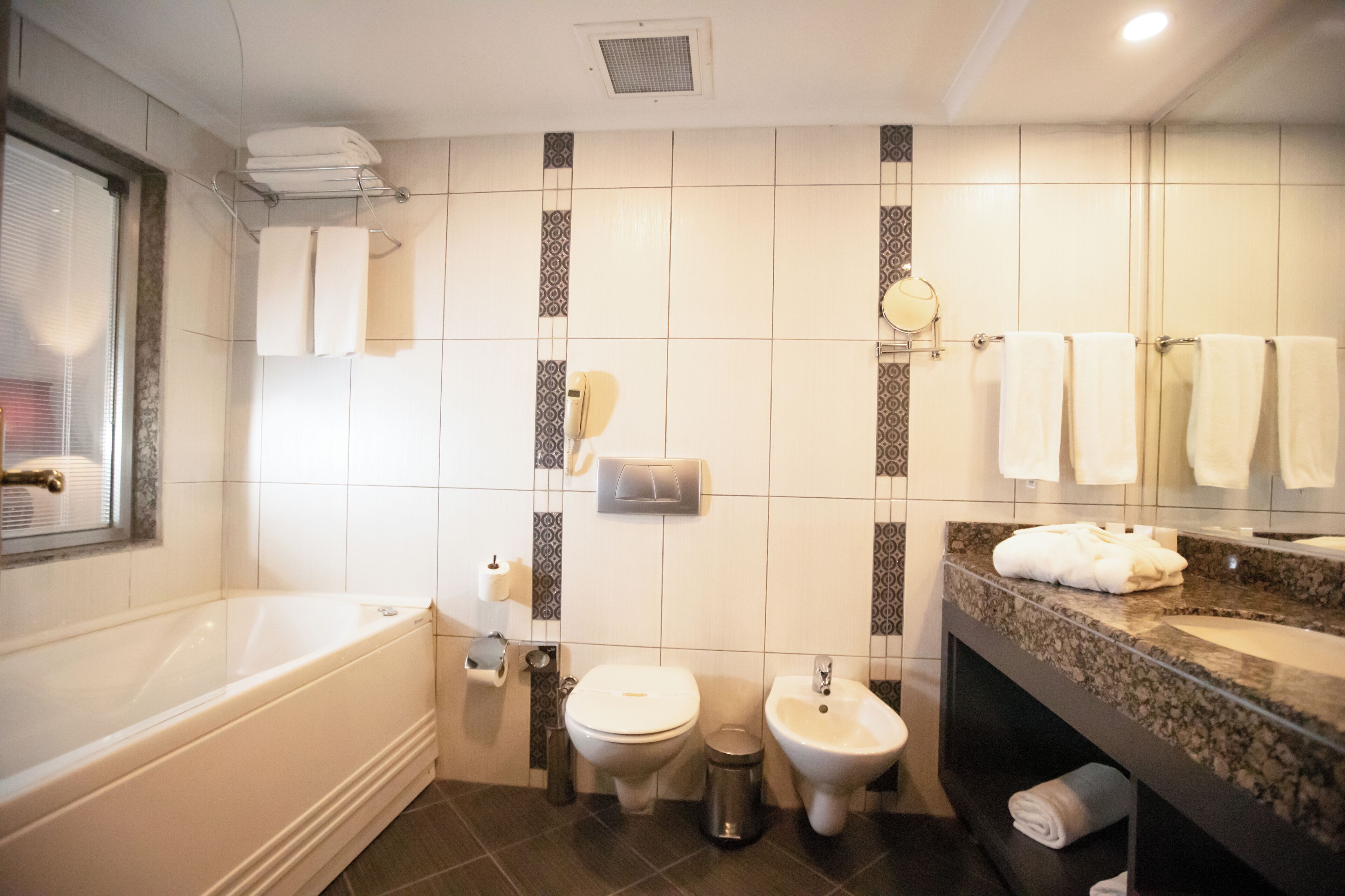 presidential suite, 1 king bed, sea view | bathroom | hair dryer, slippers, towels