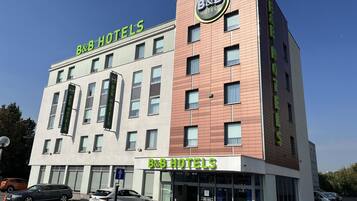 A B&B hotel with a modern design, featuring a prominent B&B logo on the facade.