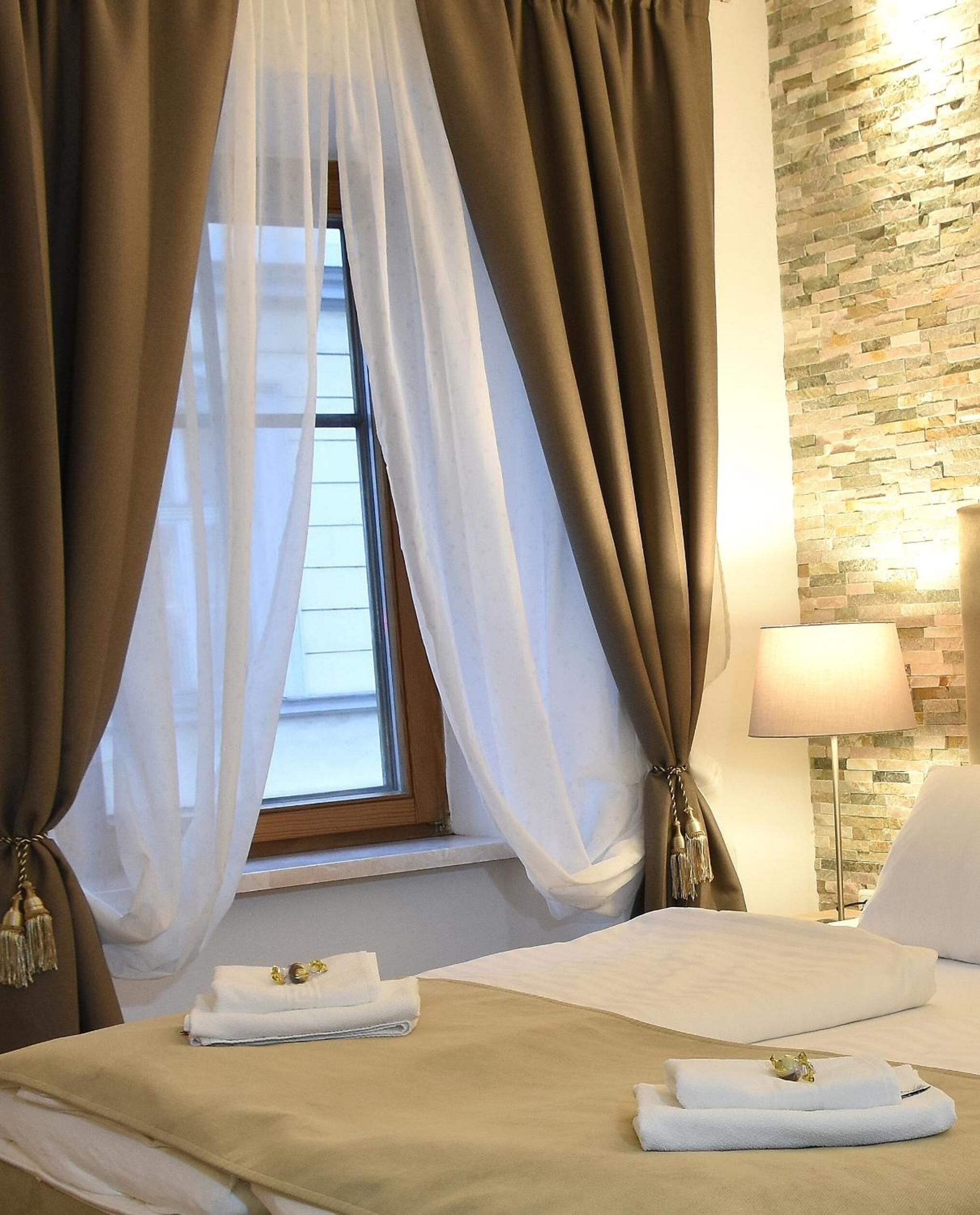 Premium bedding, desk, laptop workspace, blackout drapes