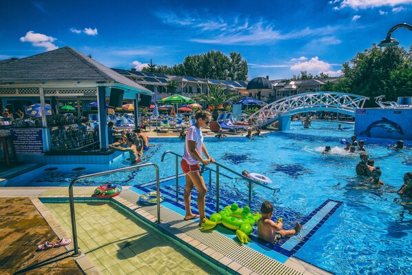 3 indoor pools, outdoor pool, open 7:00 AM to 7:00 PM, pool umbrellas