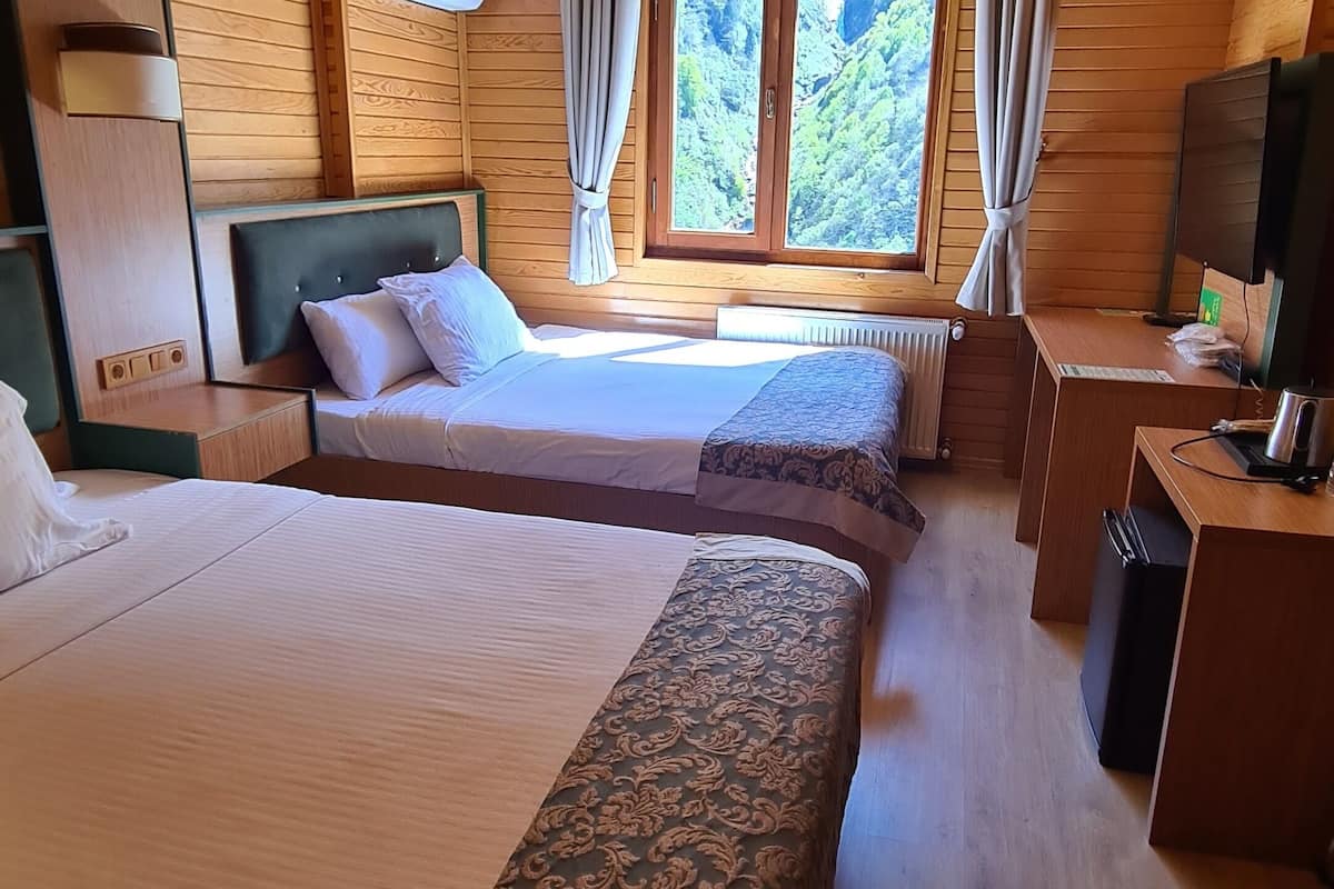 standard triple room, multiple beds | minibar, in-room safe, desk, laptop workspace