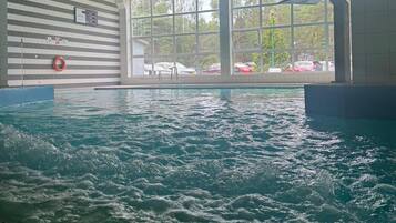 Indoor pool, open noon to 9:00 PM, lifeguards on site