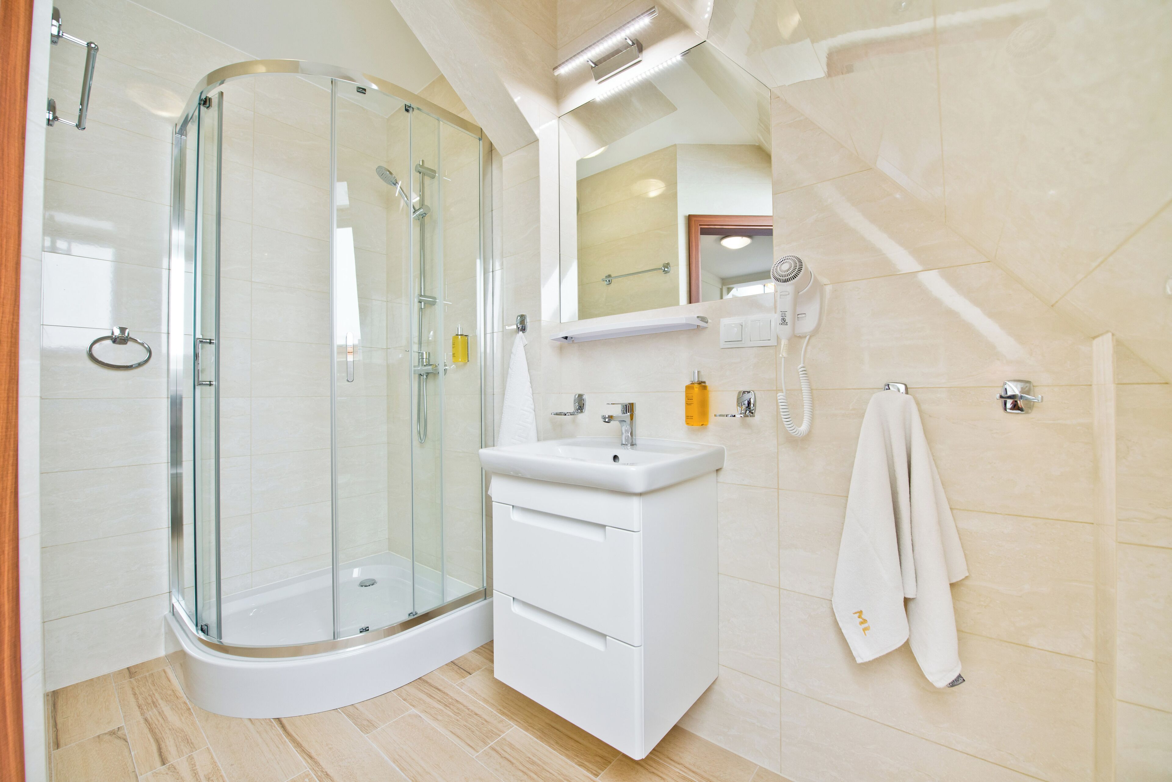 hair dryer, towels, soap, shampoo