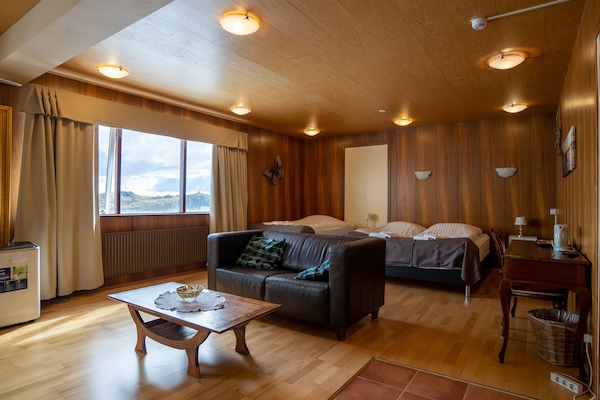 Premium bedding, desk, laptop workspace, soundproofing