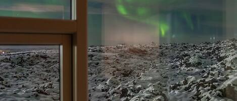 A room with a view of the aurora borealis.