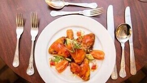 A plate of food with utensils on a table. - Lake Of Shadows (Buncrana)
