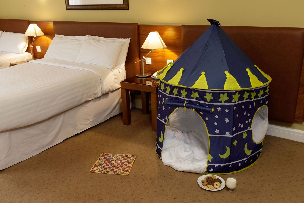 family room | premium bedding, desk, soundproofing, iron/ironing board