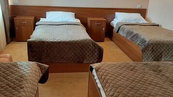 Standard Quadruple Room | Minibar, blackout drapes, iron/ironing board, free WiFi