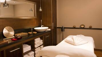 Enjoy a refreshing bathroom with a large mirror, vanity, and sink, plus ample storage and plush towels.