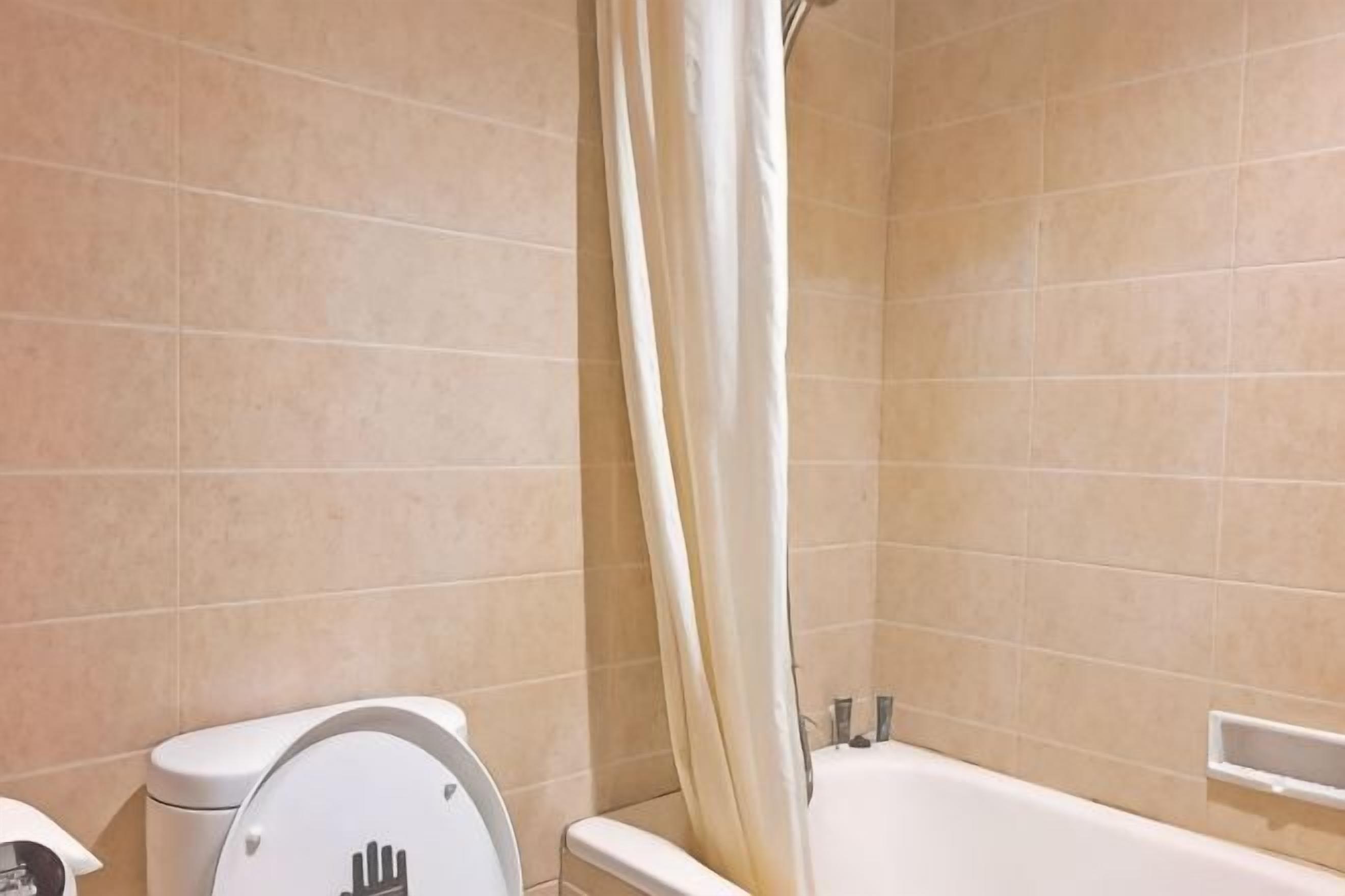 Bathroom | Shower, free toiletries, slippers, towels