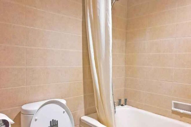 Bathroom | Shower, free toiletries, slippers, towels