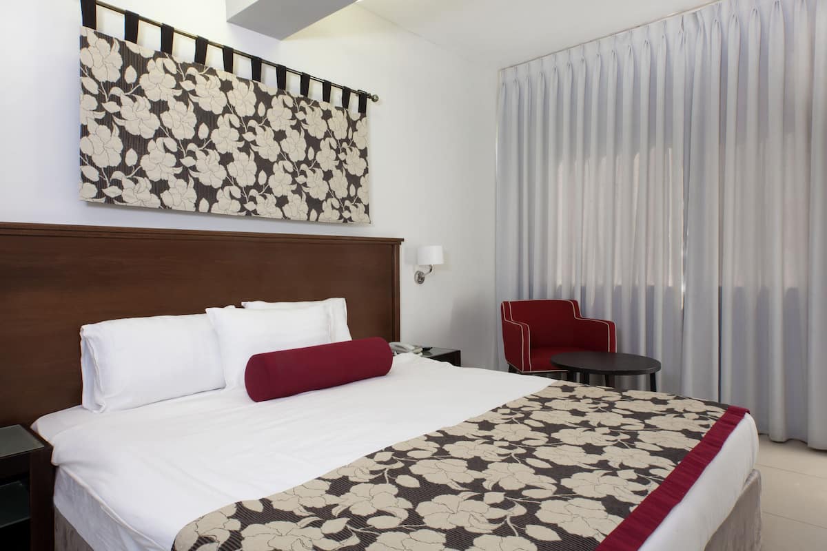 Standard Room | Minibar, in-room safe, iron/ironing board (on request), cots/infant beds
