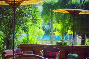 Outdoor pool, open 9 AM to 8 PM, pool umbrellas, pool loungers