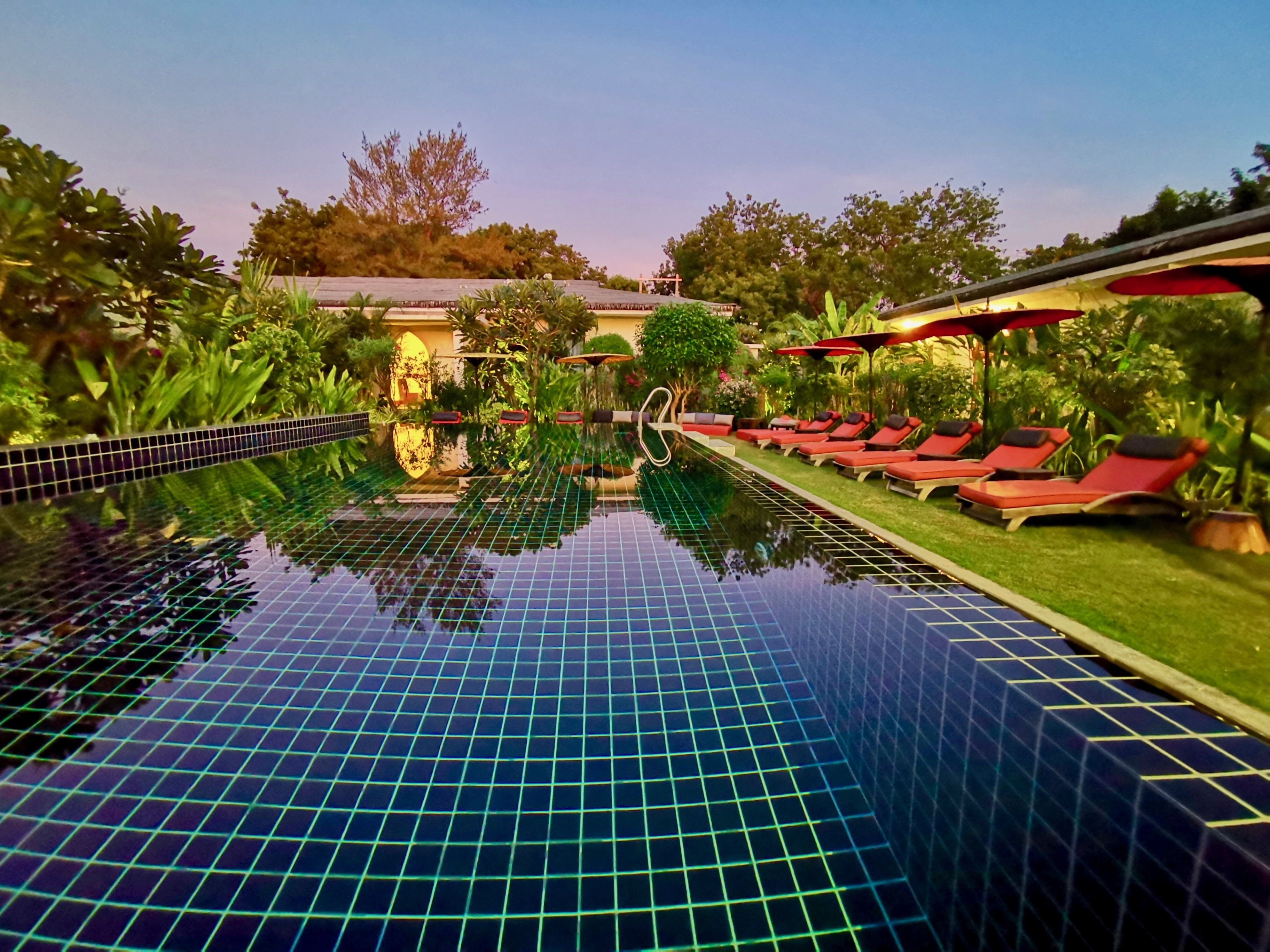 outdoor pool, open 9 am to 8 pm, pool umbrellas, pool loungers