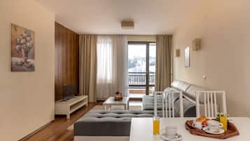 Apartment, 2 Bedrooms (Free Mineral Pool, Saunas, Steam bath) | Living area | Flat-screen TV