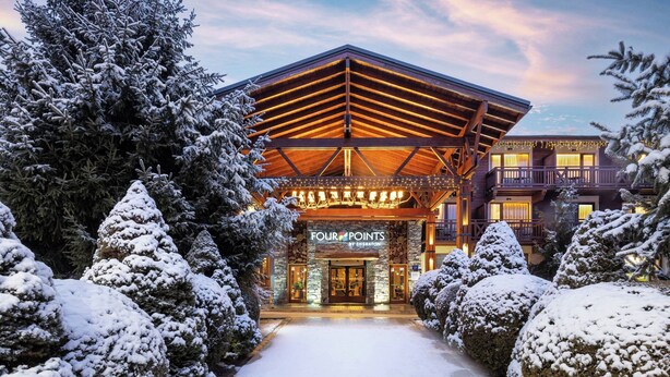 A snow-covered building with a sign reading "FOUR POINTS". - Four Points by Sheraton Bansko (Bansko)