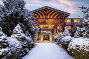 A snow-covered building with a sign reading "FOUR POINTS". - Four Points by Sheraton Bansko (Bansko)