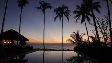 Seasonal outdoor pool, open 8 AM to 7 PM, pool umbrellas, pool loungers